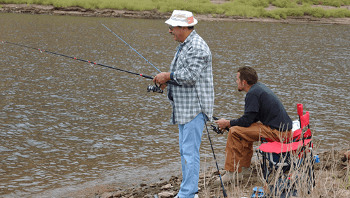 Two men fishing on the shore of Diamond Valley Lake